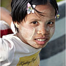 Burmese girl with Tanaka painting, Kyaikhtiyo, Myanmar