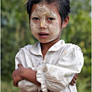 Burmese girl with Tanaka painting, Kyaikhtiyo, Myanmar